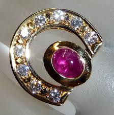 Horse shoe ring 18K gold w/ natural 1.25 cts. natural ruby and 9 diamonds